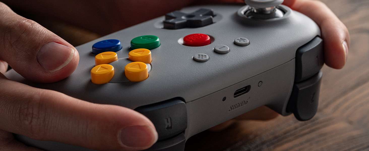 8BitDo 64 Bluetooth Controller (Hardware) - Review 6 8BitDo 64 Bluetooth Controller Lifestyle V2 3 https://staging.mkaugaming.com/all-review-list/8bitdo-64-bluetooth-controller-hardware-review/